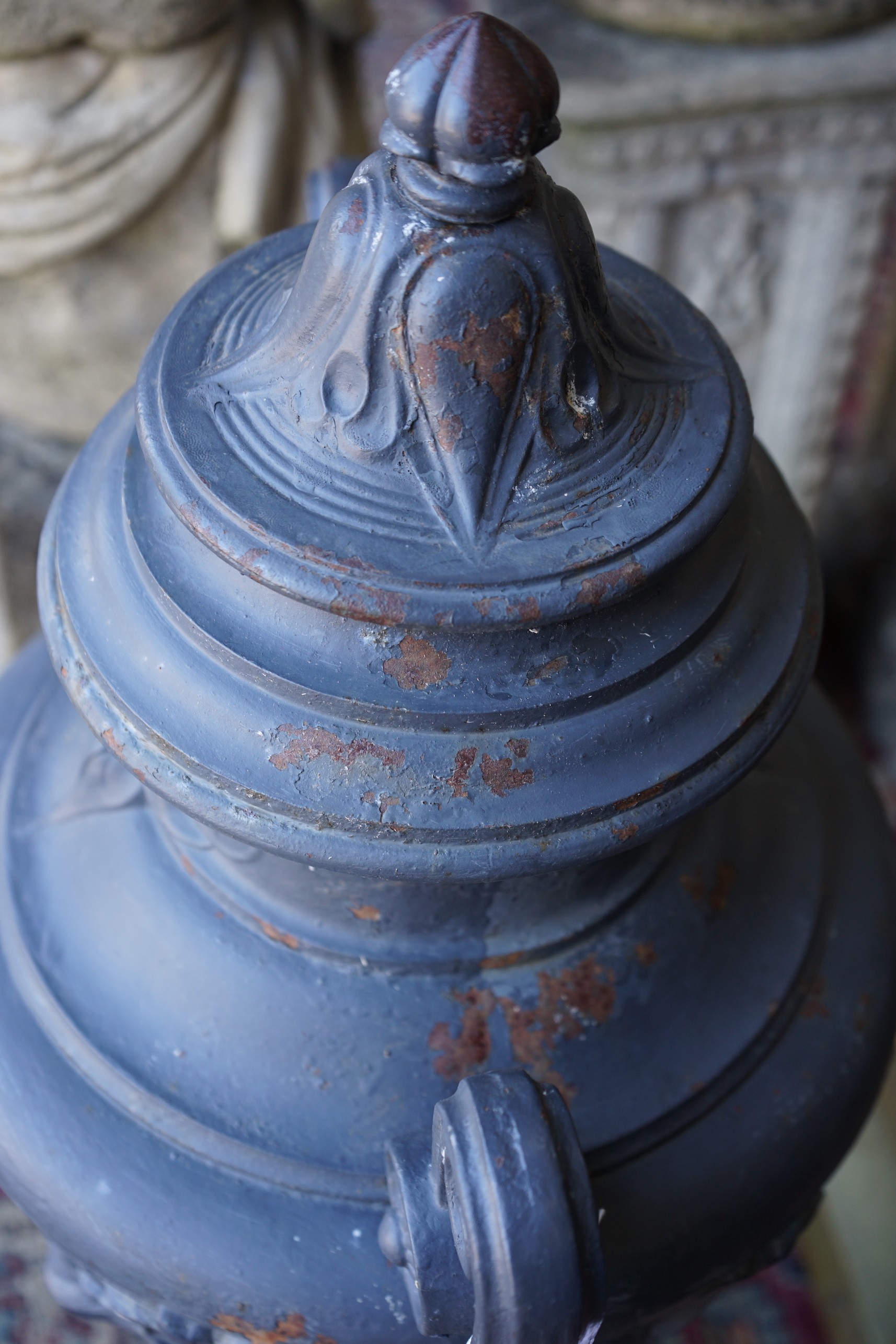 A painted cast iron two handled garden urn, height 80cm